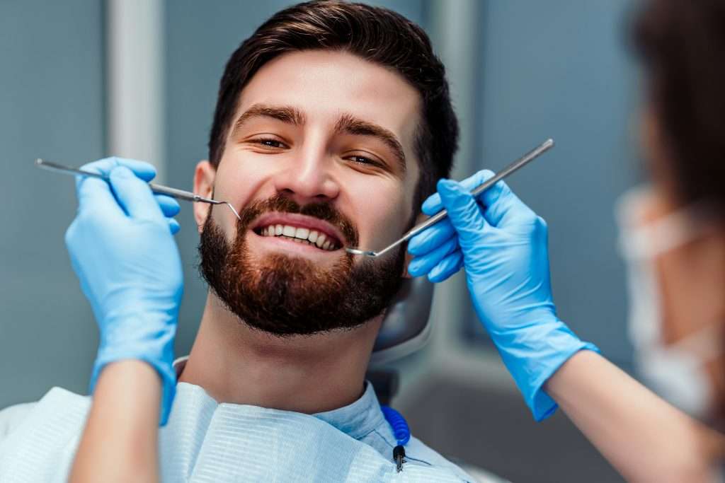 patient smiling at dentist